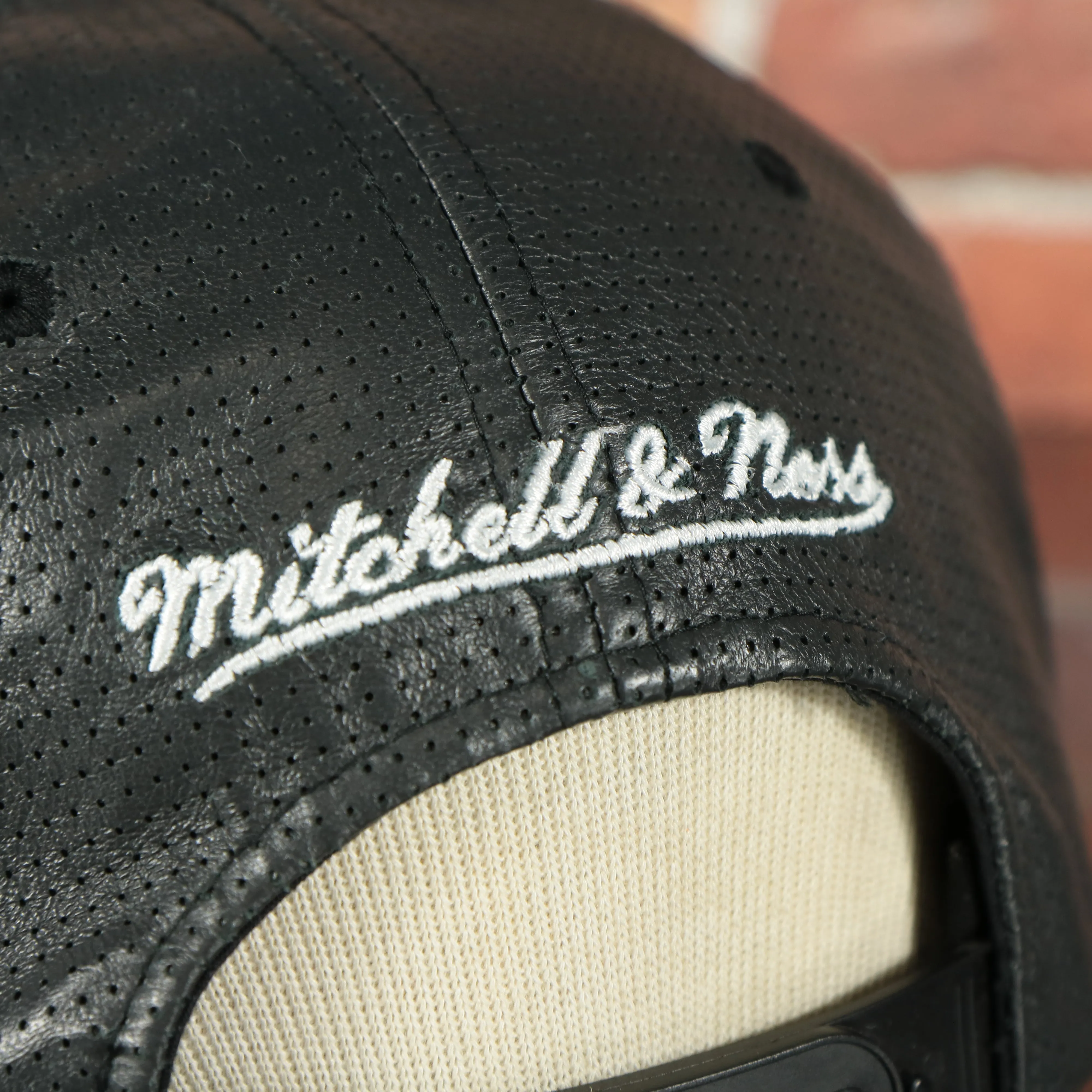 Brooklyn Nets 100% Genuine Perforated Leather Mitchell and Ness Snapback Hat